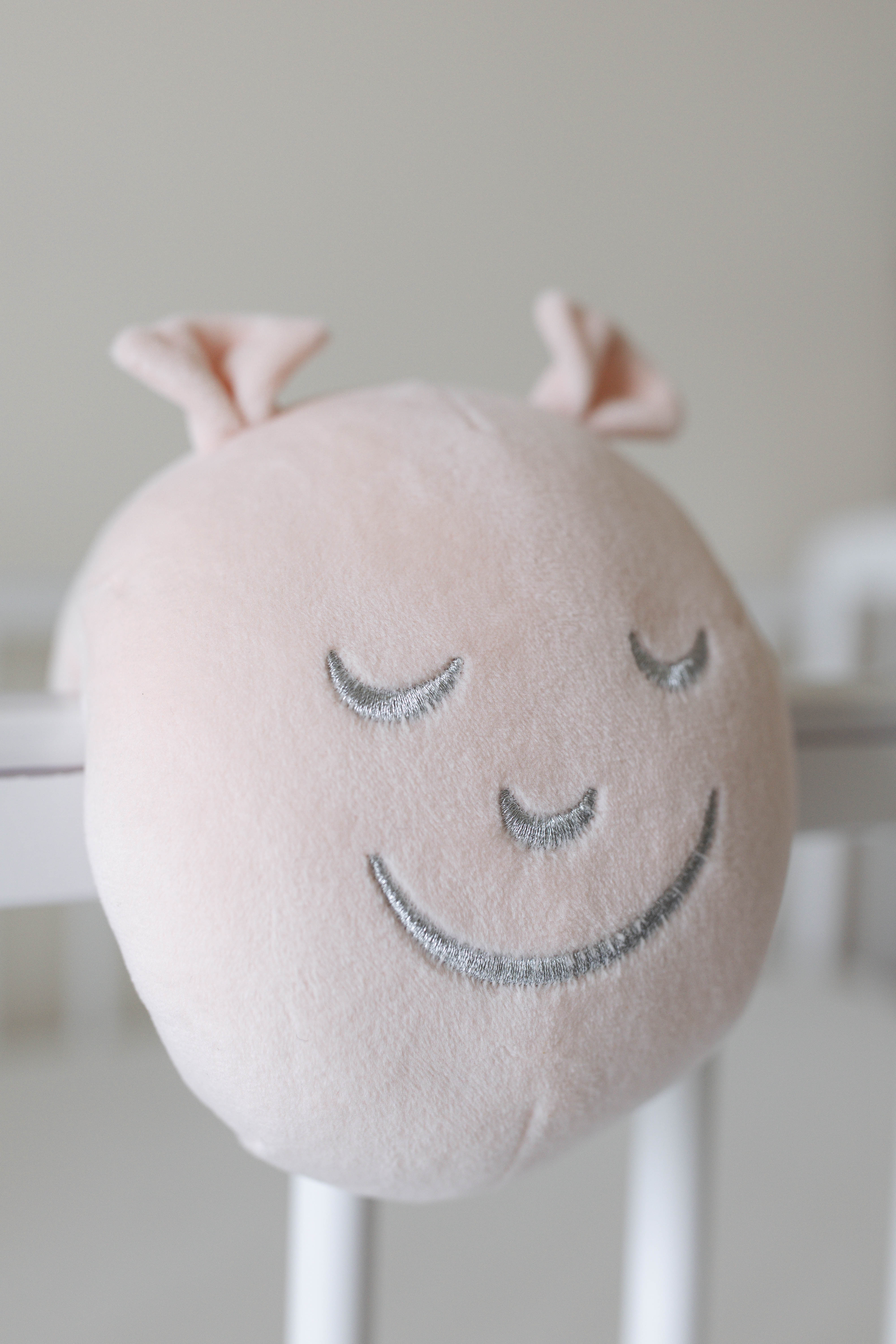 Close-up of Cotterpillar’s soft finish and silver embroidered face